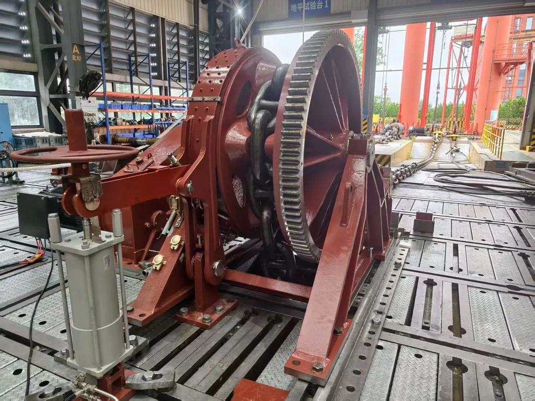 Large marine windlass assembly positioned for workshop inspection